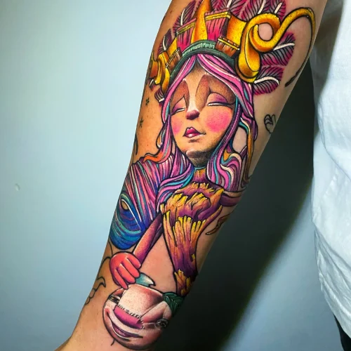 tattoo acuarela de un dibujo animado en el antebrazo
