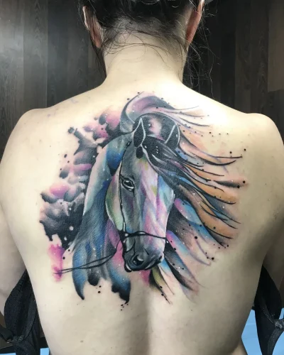 tatuaje de cover up en la espada de un unicornio