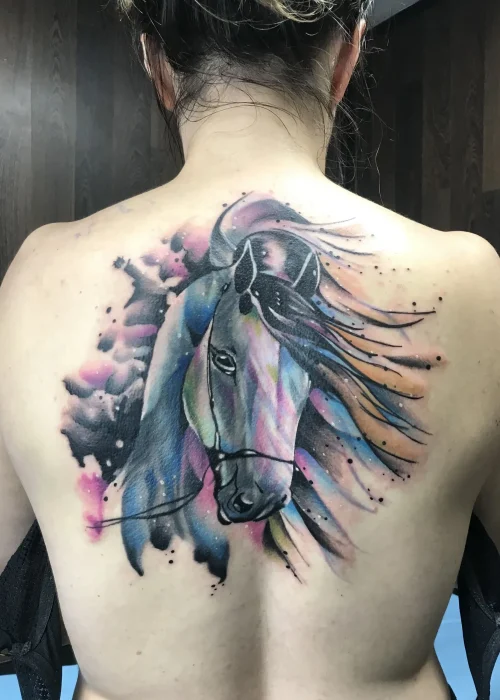 tatuaje de cover up en la espada de un unicornio